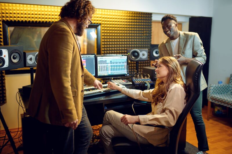 male-and-female-performers-recording-studio-1.jpg